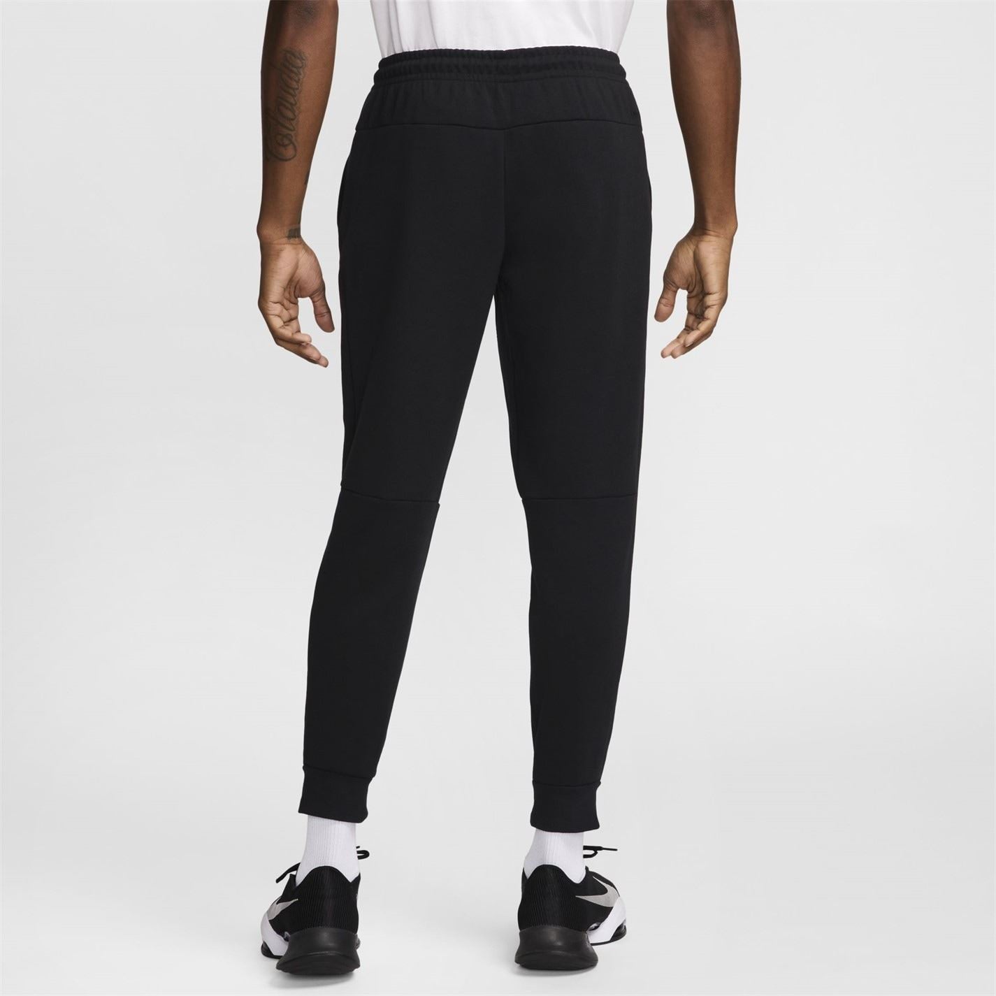 Nike Primary Solid Patterned Slim Joggers