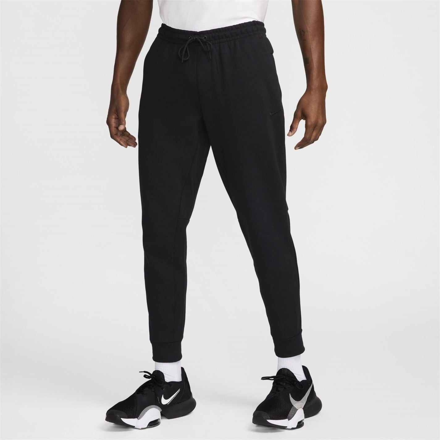 Nike Primary Solid Patterned Slim Joggers