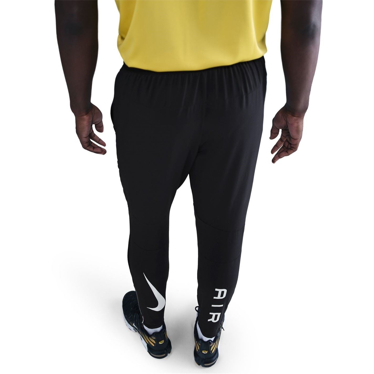 Nike Air Run Solid Patterned Track Pants