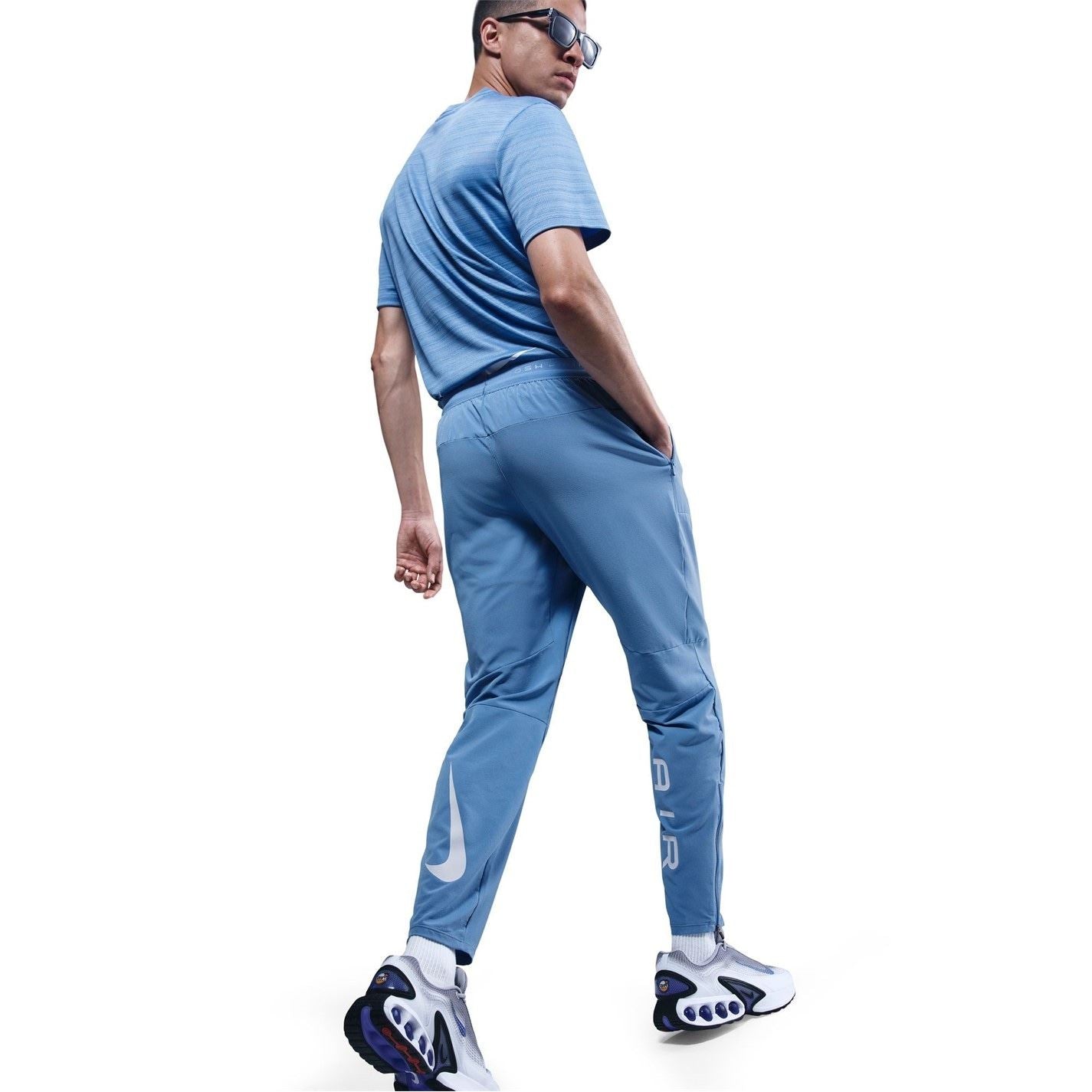 Nike Air Run Solid Patterned Track Pants