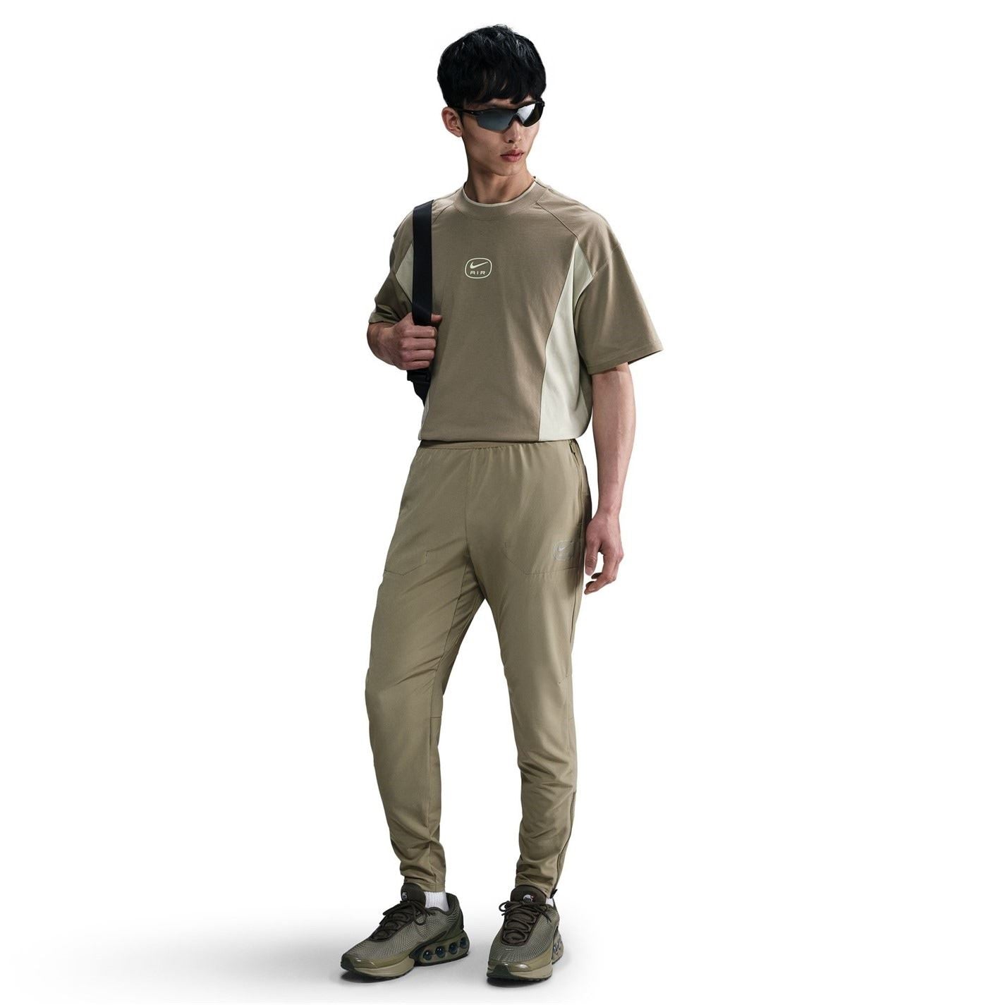 Nike Air Run Solid Patterned Track Pants