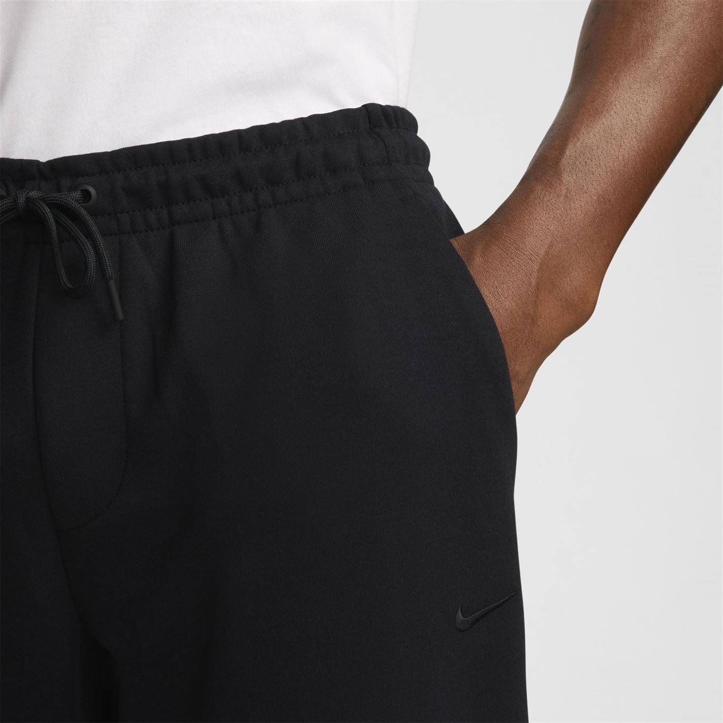 Nike Primary Solid Patterned Slim Joggers